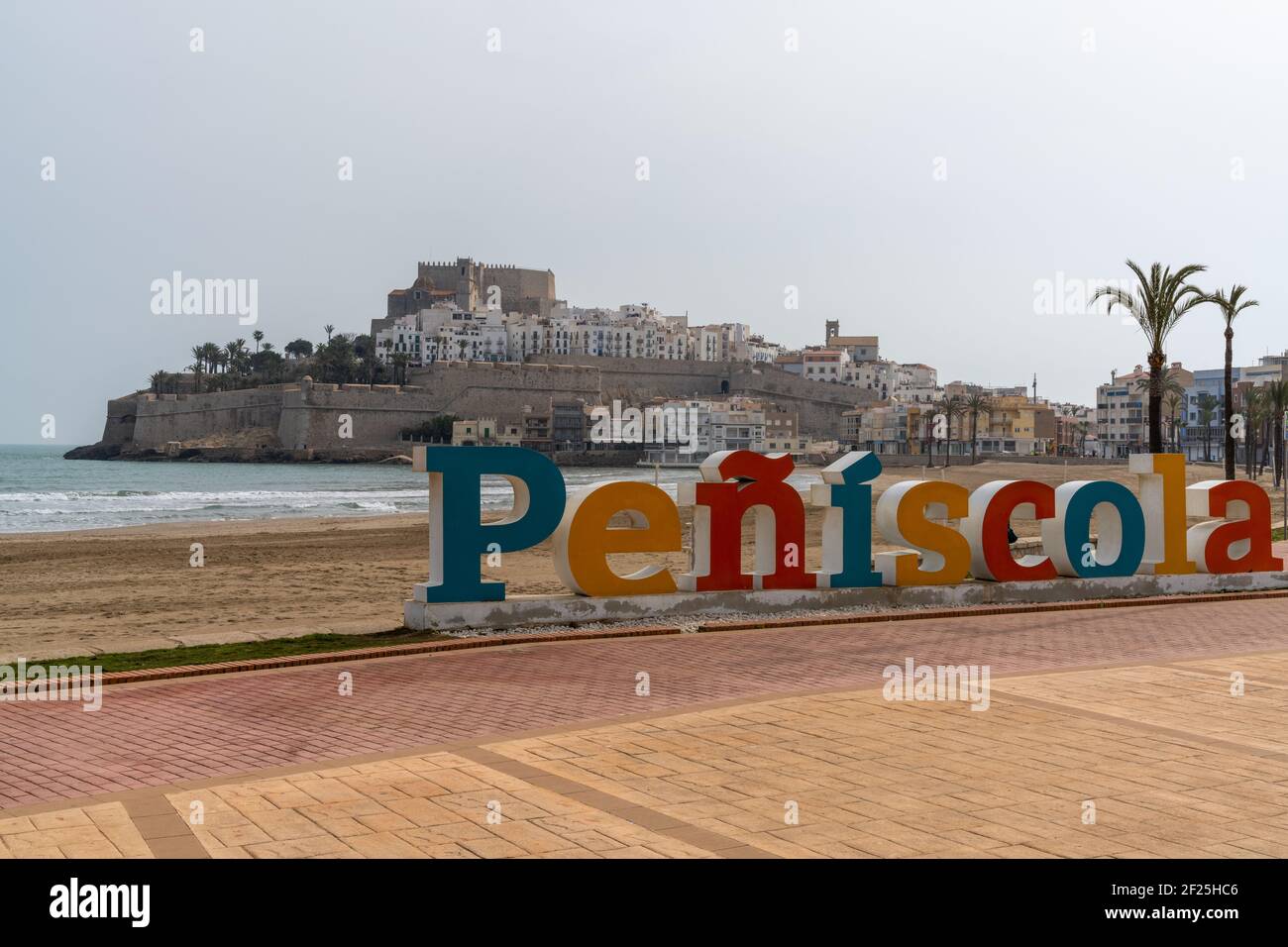 A view of the town sign and beach of Peniscola on the Costa del Azahar in Spain Stock Photo