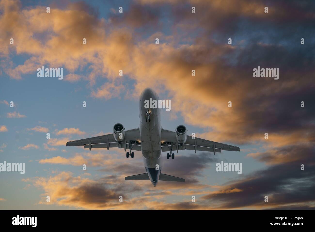 Airplane in the sunset sky flight travel transport airline background ...