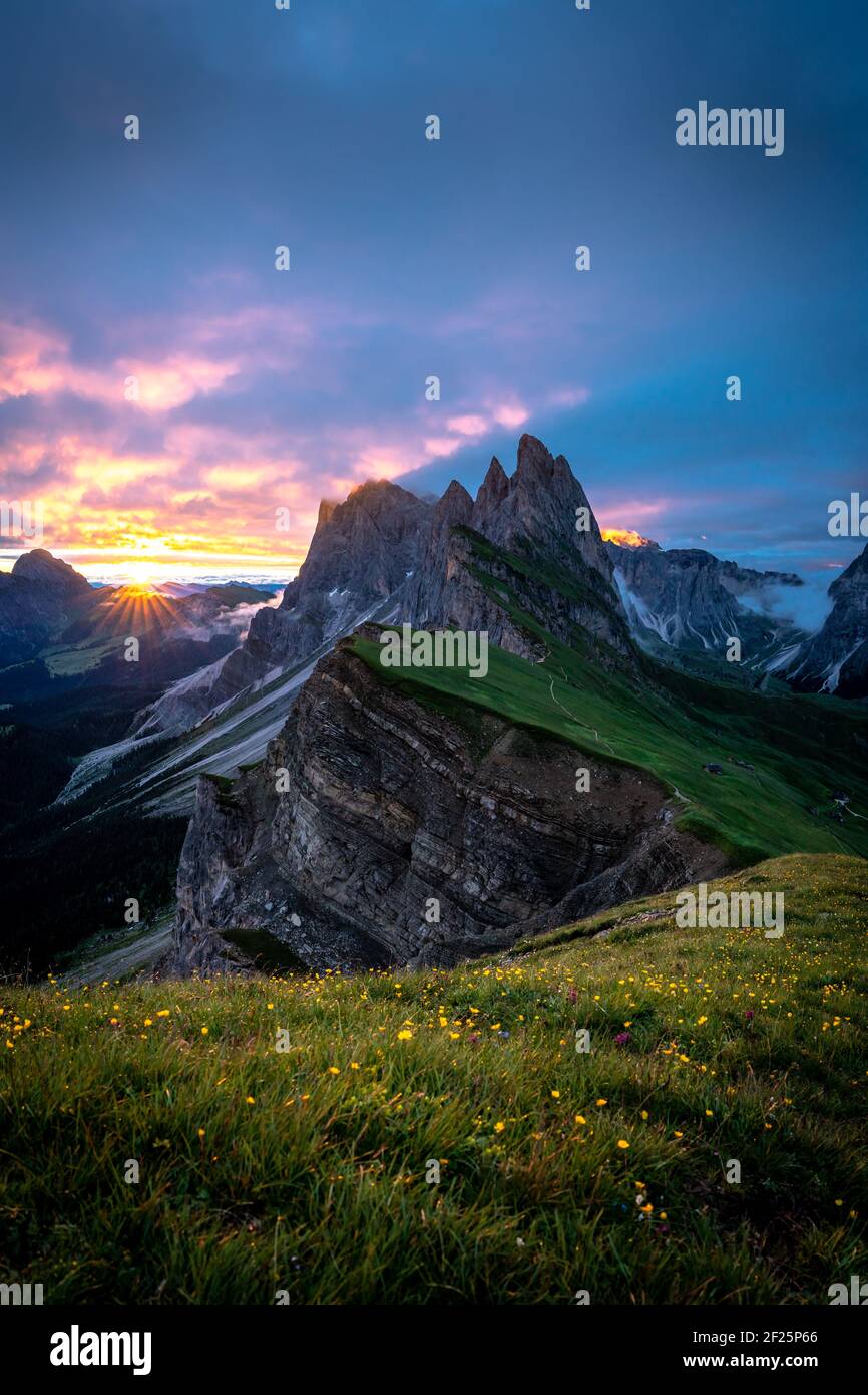 Sunrise at the mountain peaks of seceda in the dolomites. Stock Photo