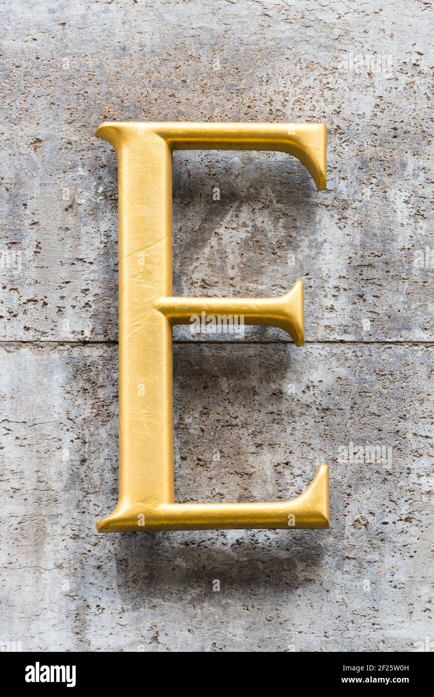 Golden letter E with clear serifs Stock Photo