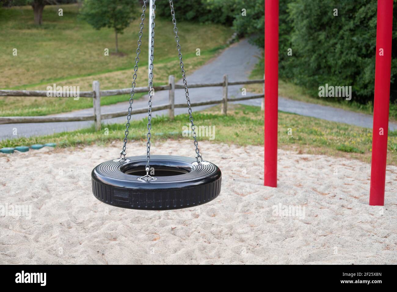 Tire swing on playground in the park Stock Photo Alamy