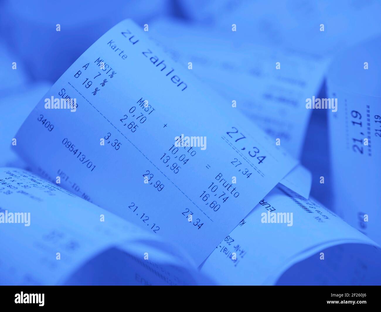 Blue receipts with the imprint "zu zahlen", translation "to pay" Stock Photo