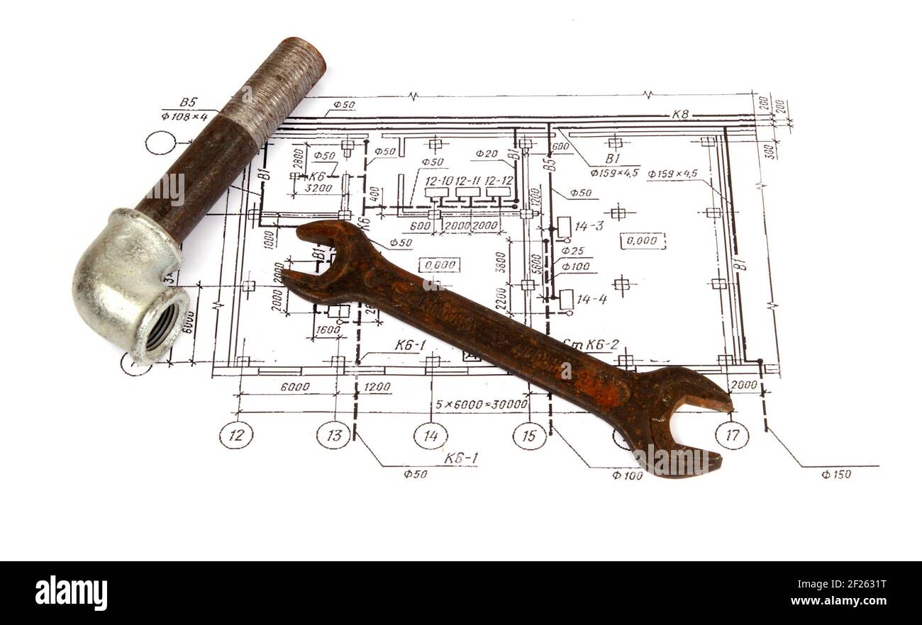 Plumbing parts and tools on the drawing, close-up Stock Photo - Alamy