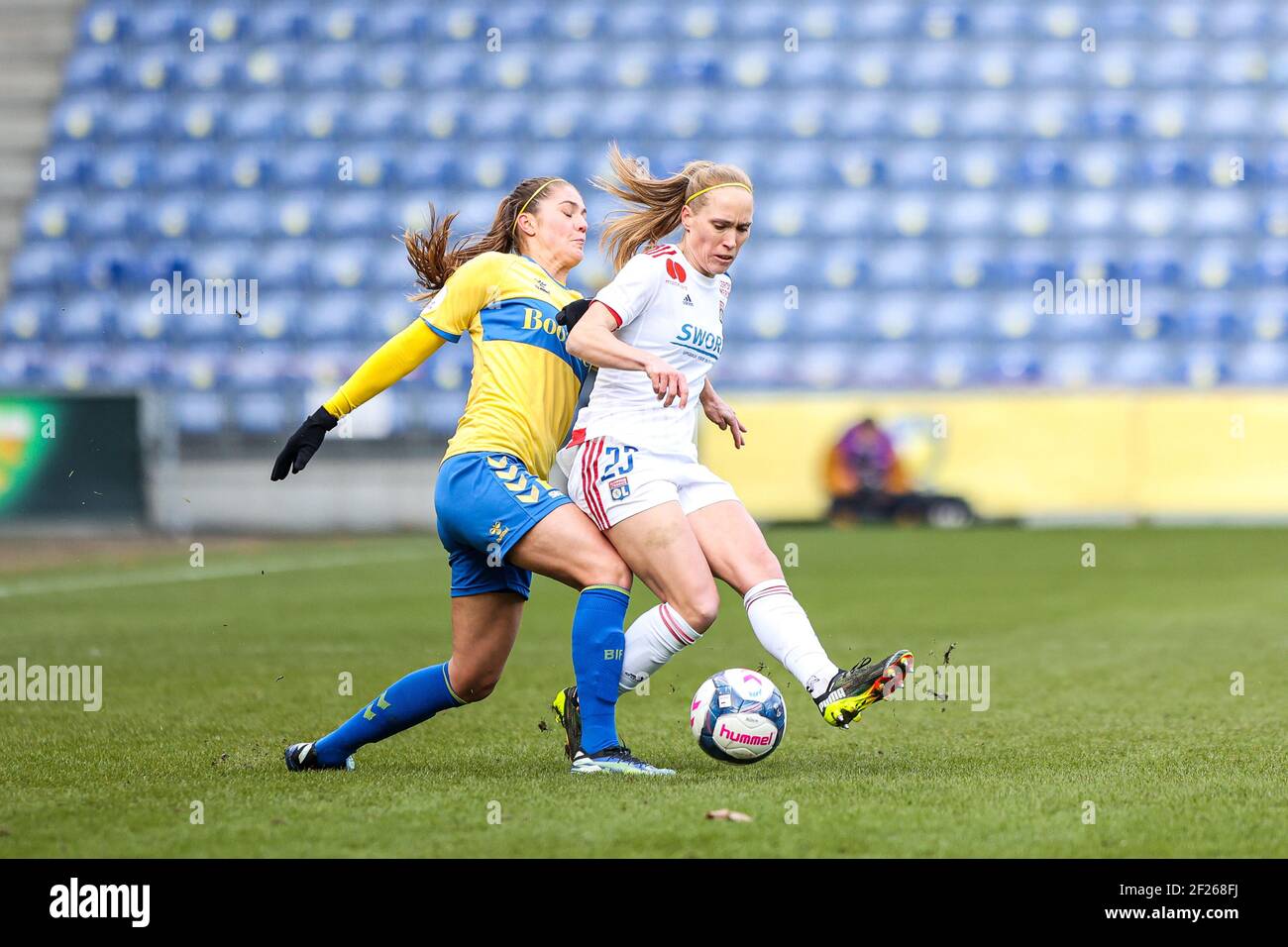 Brondby, Denmark. 10th Mar, 2021. Janice Cayman (23) of Olympique Lyon is  being tackled by Mille Gejl (22) of Brondby IF during the UEFA Women's  Champions League match between Brondby IF and
