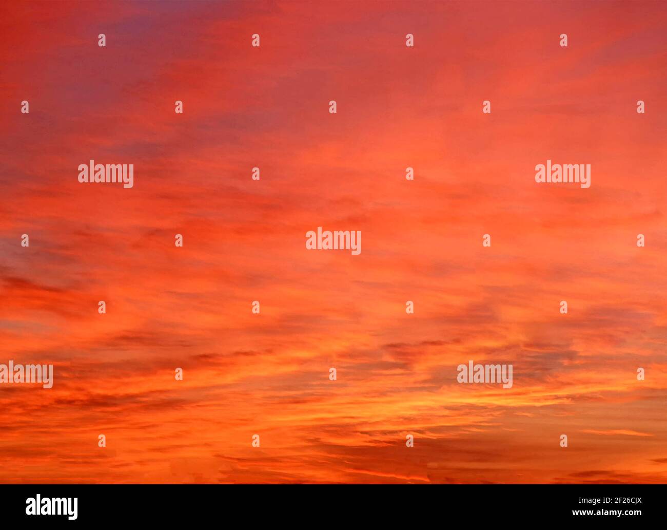 Film image for abstract background use of a 1980s vivid dramatic summer sunset sky glowing & reflecting on a cloud base varying between discernible horizontal banding layers with fiery orange red & yellow colours to overall soft smooth tints above county of Essex England in UK 80s archival historical archive image Stock Photo