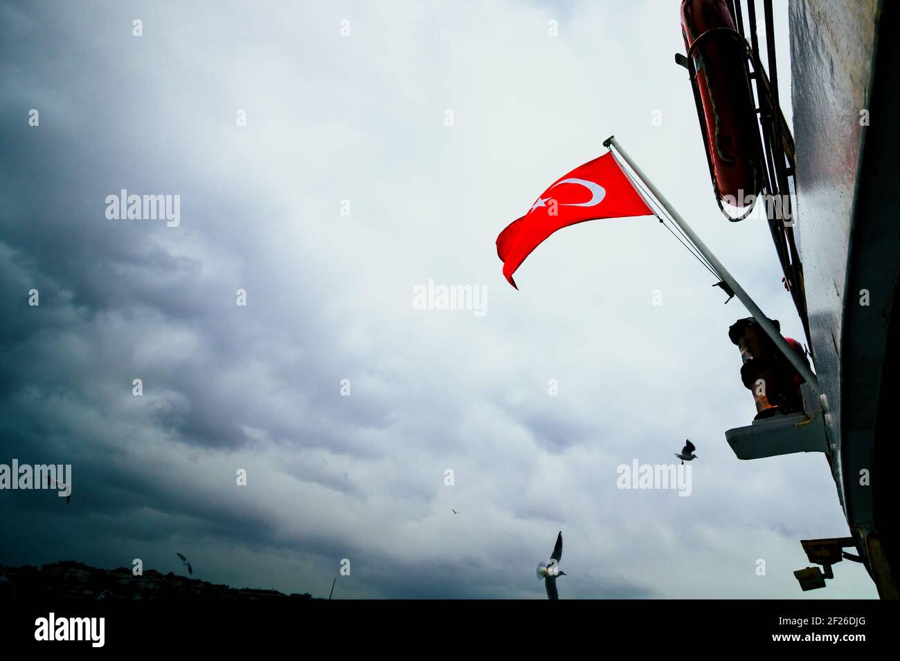 Flag of Turkey on the boat and cloudy sky. Turkish nation. Turkish independence day. 19th may, 23th april, 30th august, 29th october Stock Photo