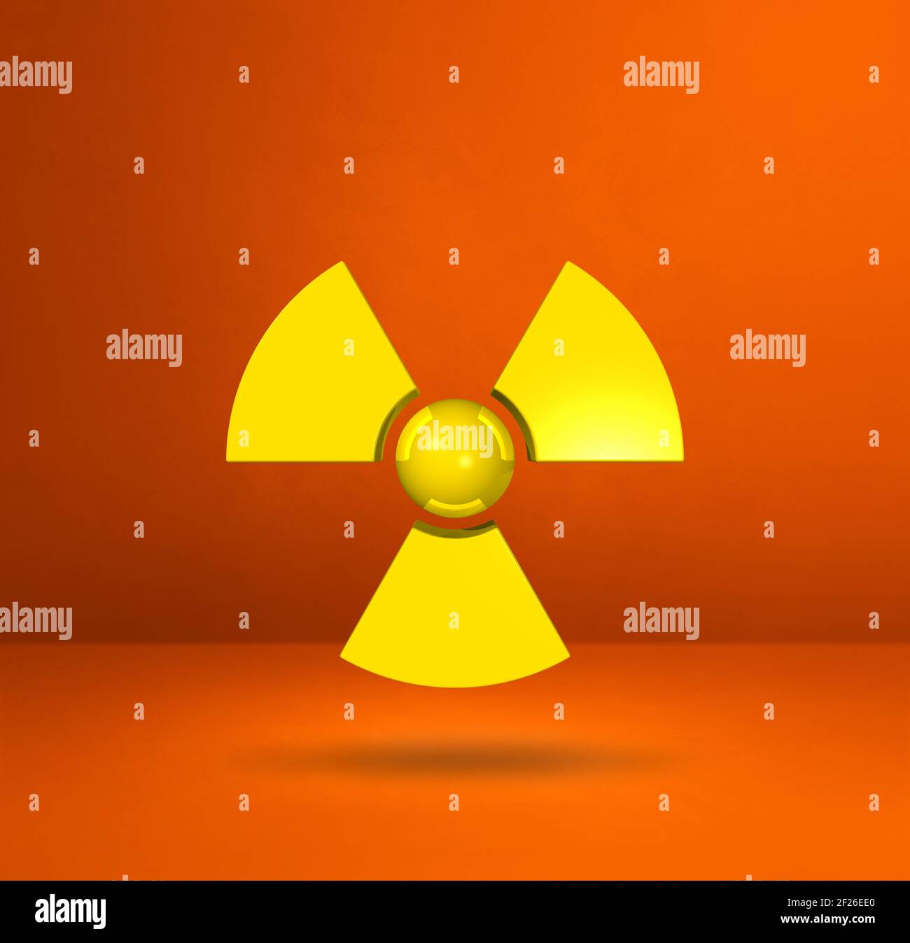Radioactive symbol on a orange studio background Stock Photo