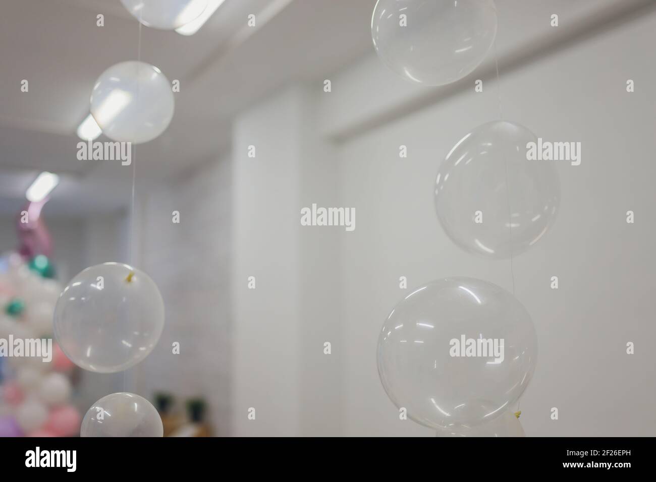 White And Transparent Balloons On Brick Wall Background Stock Photo
