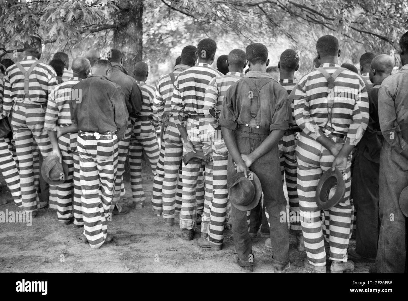 Convicts from Prison Camp at Funeral of their Warden who was killed in Automobile Accident, Greene County, Georgia, USA, Jack Delano, U.S. Farm Security Administration, May 1941 Stock Photo