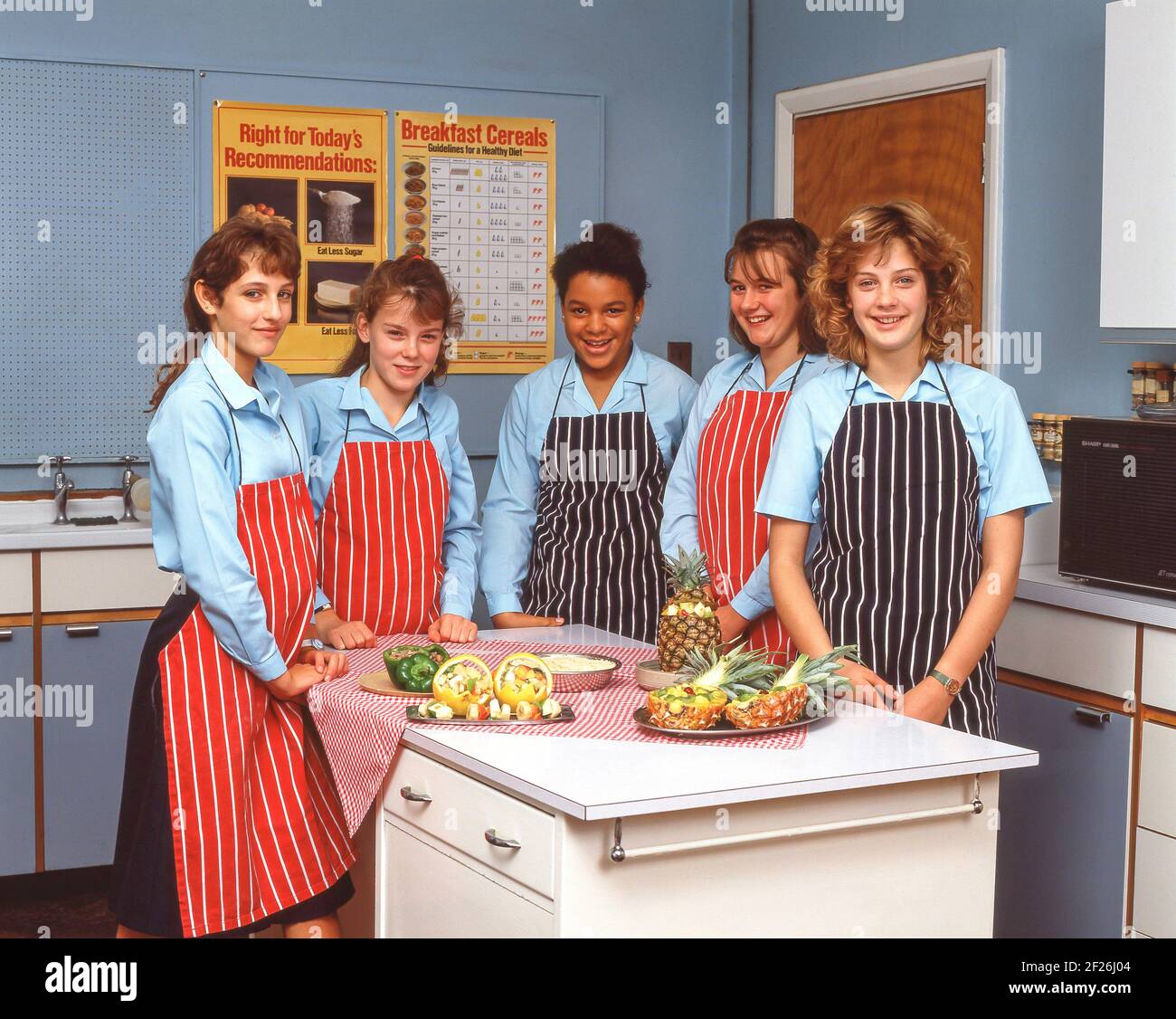 Young women in catering class, Surrey, England, United Kingdom Stock Photo