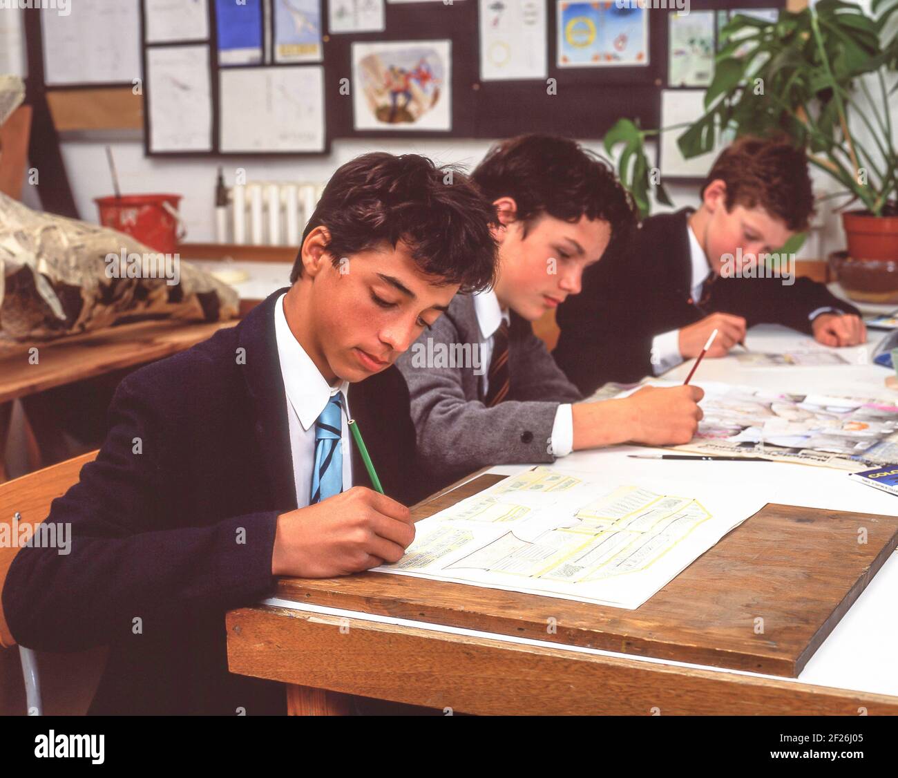 Young secondary school boys in art class, Guilford, Surrey, England, United Kingdom Stock Photo