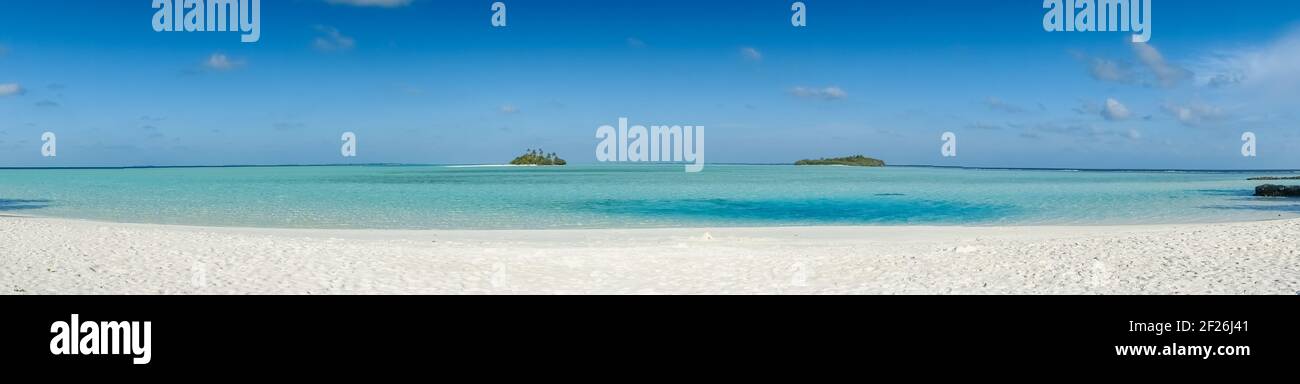 panorama of tropical beach with two isolated uninhabited islands Stock Photo