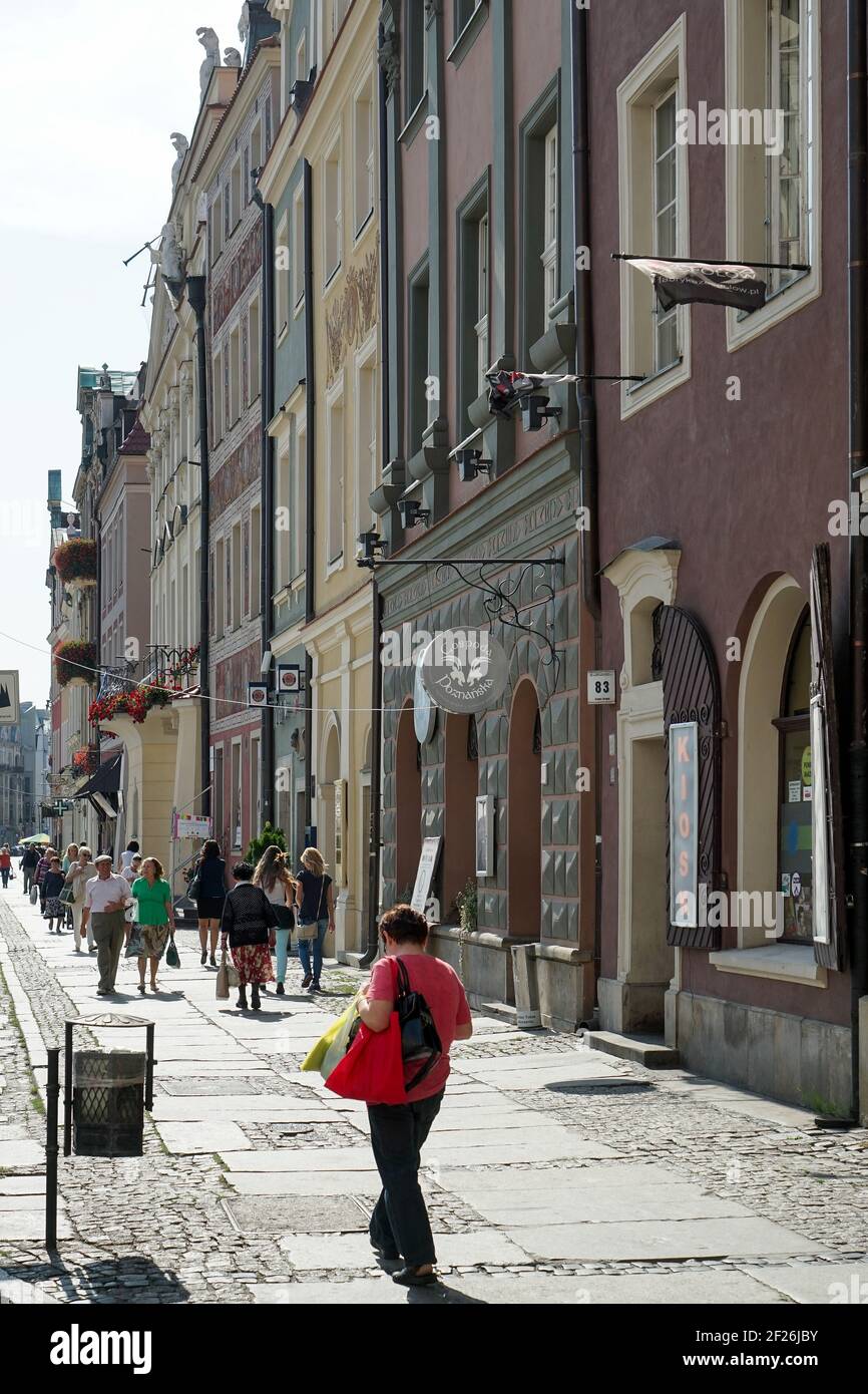 People walking down a street in Poznan Stock Photo