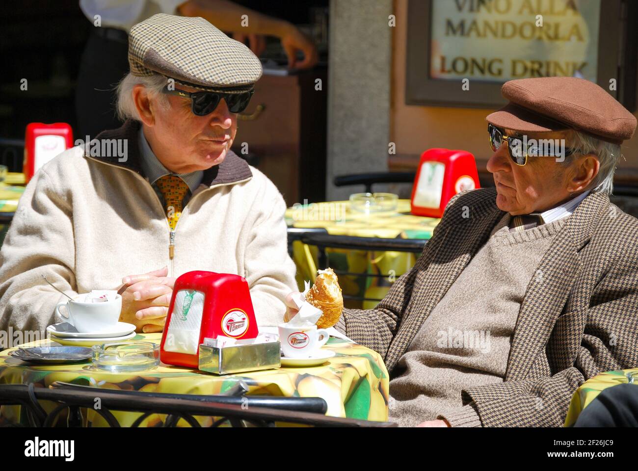 Old men in cafe, Taormina, Messina Province, Sicily, Italy Stock Photo