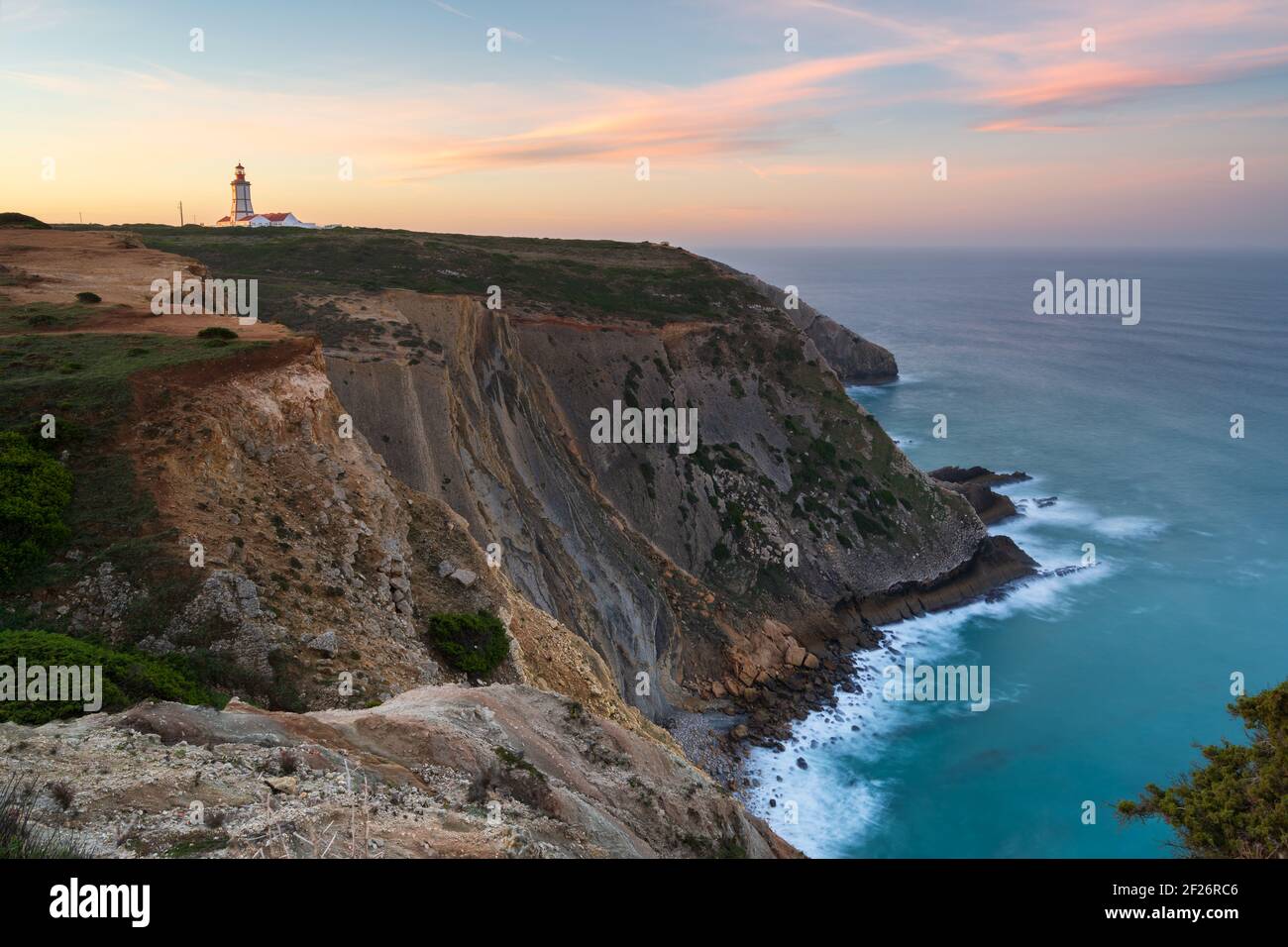 Cabo Espichel cape at sunset with sea cliffs and atlantic ocean landscape, in Portugal Stock Photo