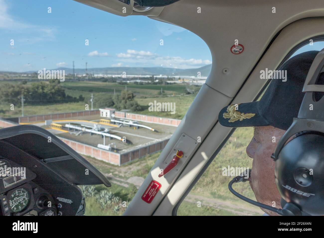 Helicopter pilot looks at petroleum pipeline infrastructure in Mexico Stock Photo