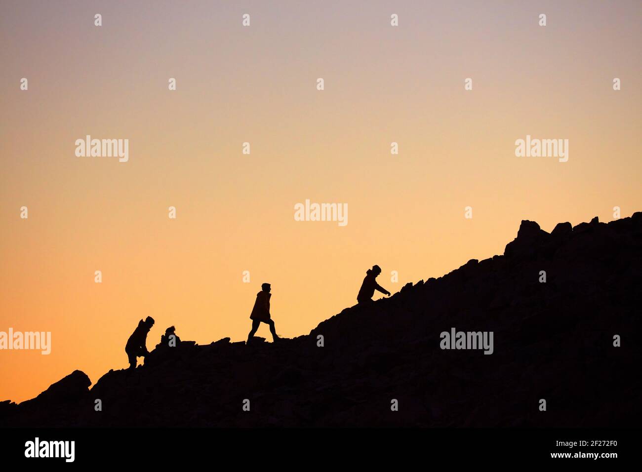 Hikers on Mt Olivier at dawn, Aoraki / Mount Cook National Park, South Island, New Zealand Stock Photo