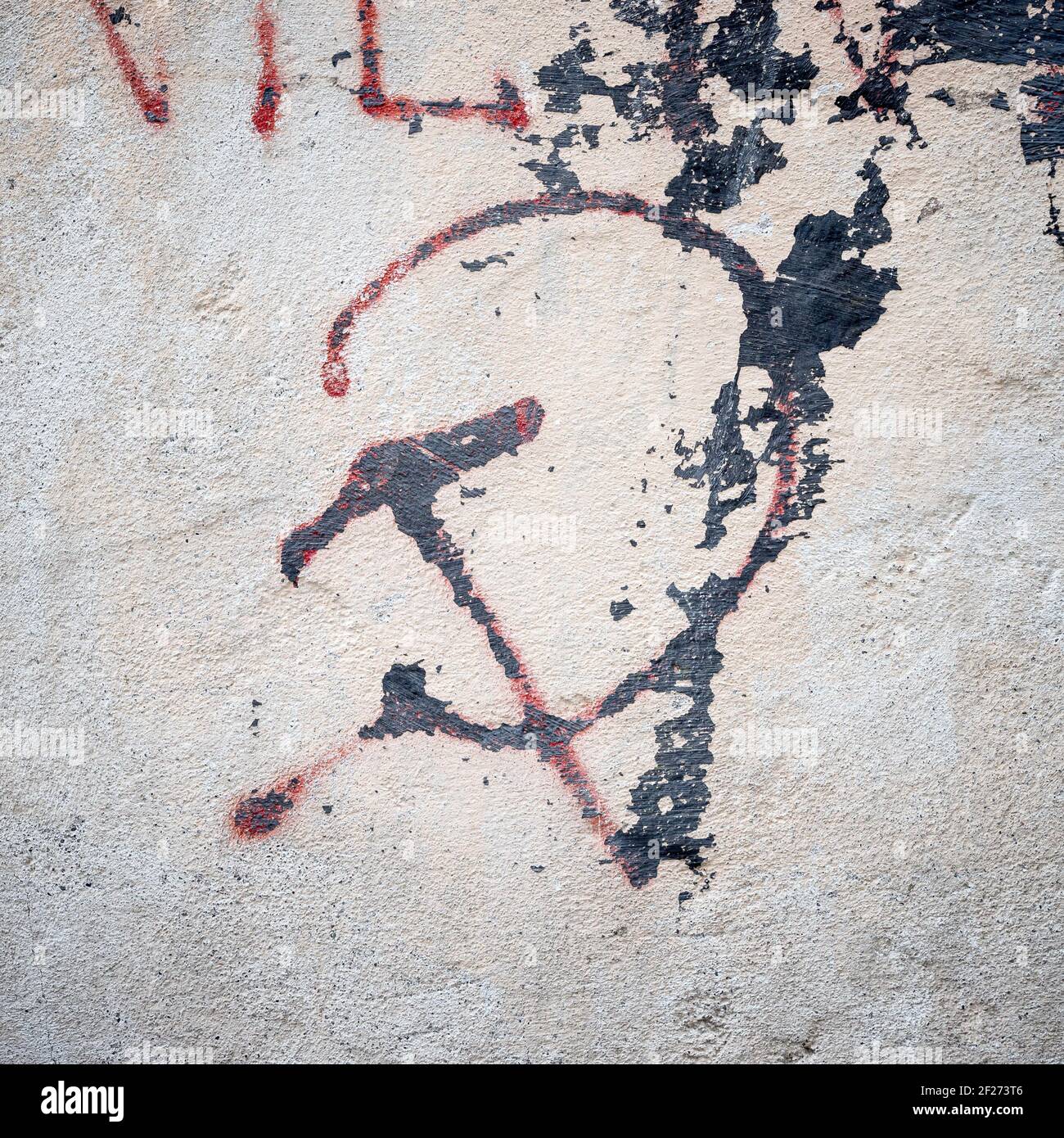 Communistic symbol: Grungy hammer and sickle graffiti on and old wall ...