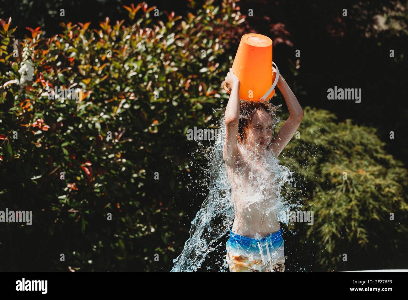 Pouring bucket water over head hires stock photography and images Alamy