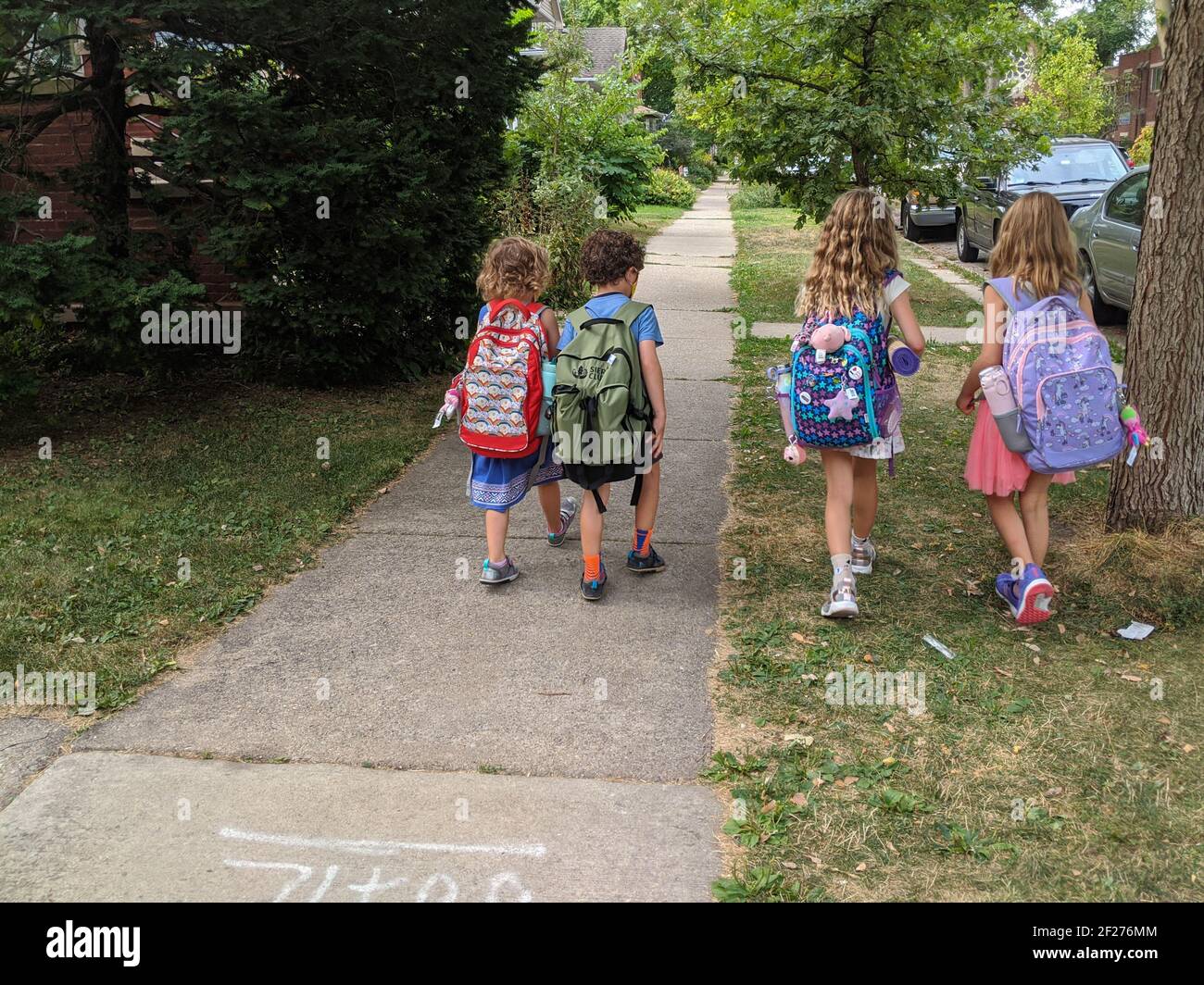 Children walking to school during the pandemic Stock Photo - Alamy