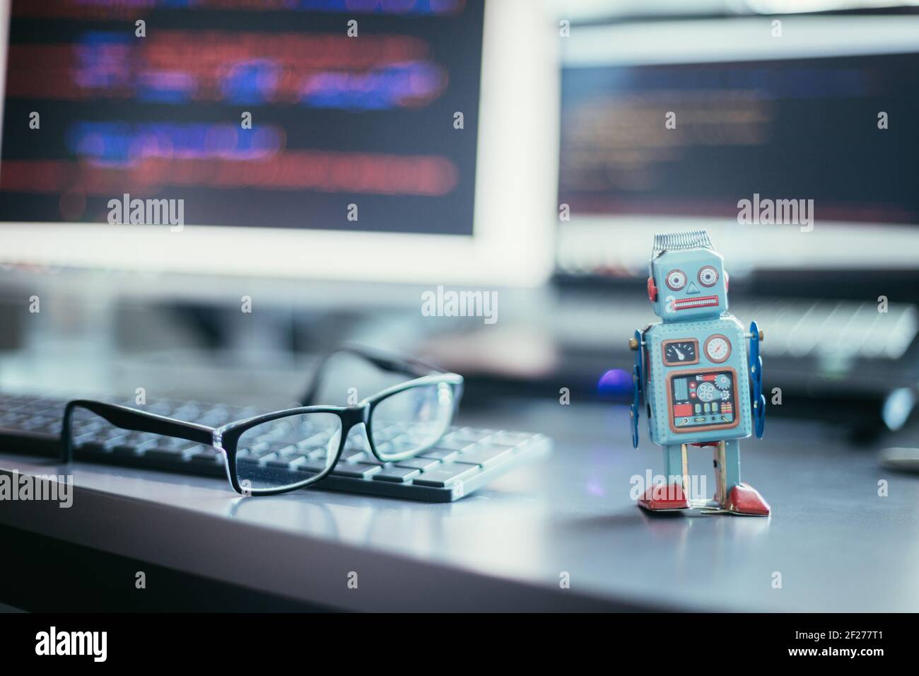 Symbol for a chatbot or social bot and algorithms, program code in the background Stock Photo