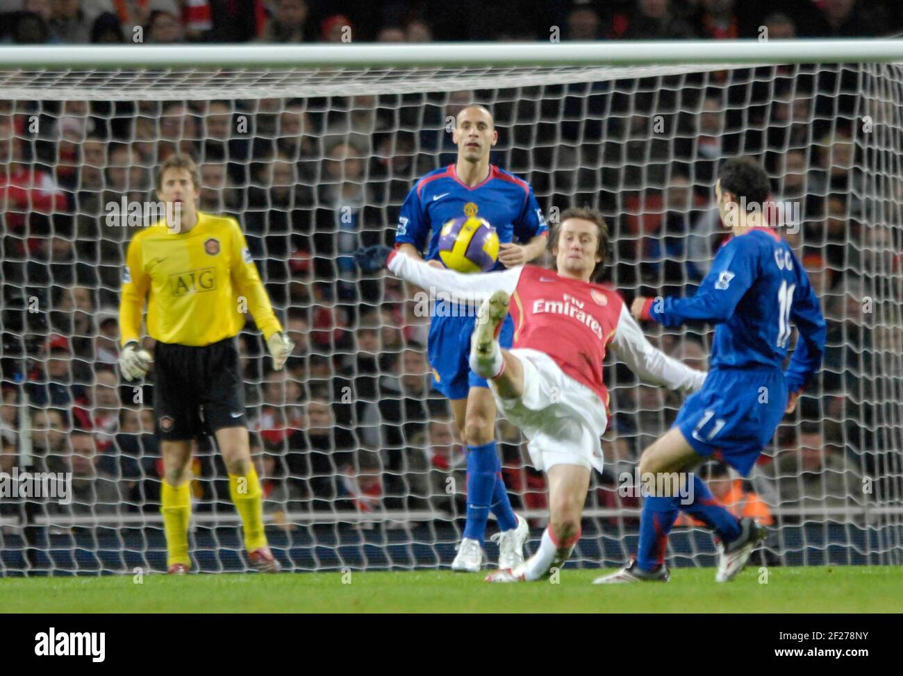 Tomas Rosicky intercepts the ball from Ryan Giggs. Stock Photo