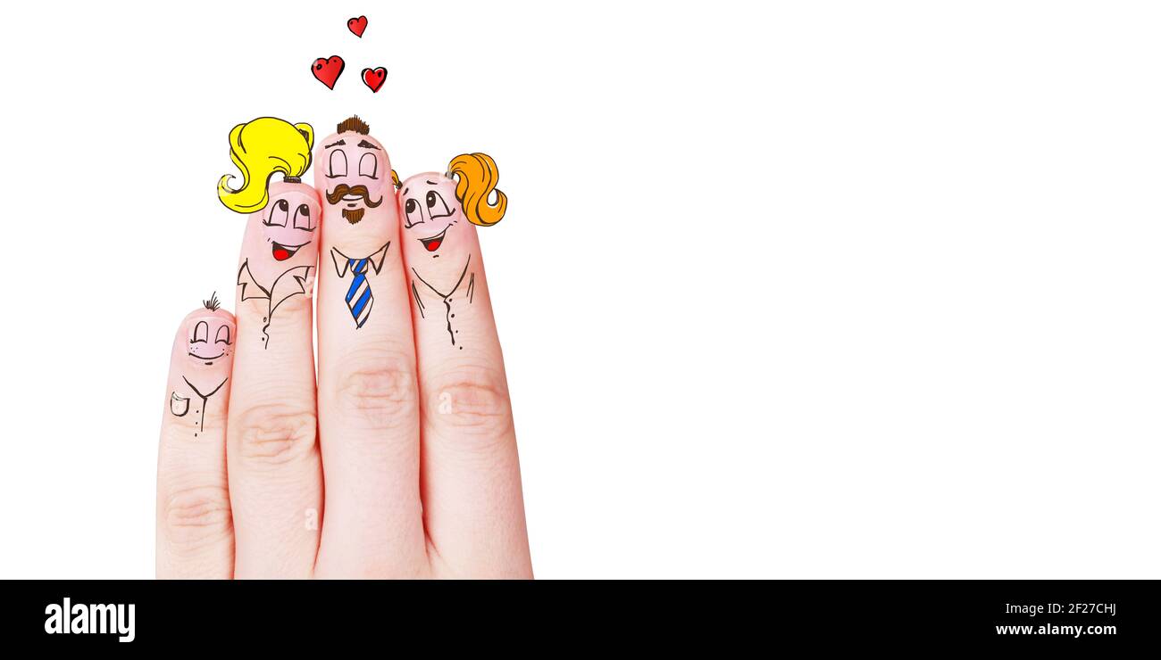 Finger puppets of loving parents with young child hugging and having fun. Stock Photo