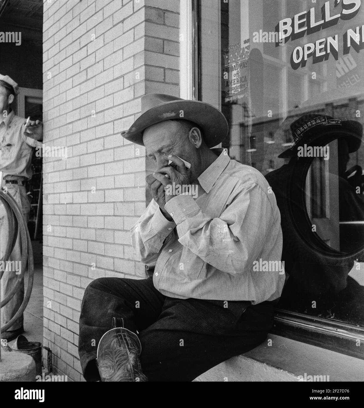 A Texas cattleman is distinguished by the type of boot he wears. Van Horn, Texas. June 1937. Photograph by Dorothea Lange Stock Photo