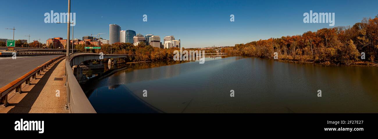Washington DC. USA 11/06/2020: An autumn landscape panorama of Potomac river Theodore Roosevelt Island (left) and downtown Arlington Virginia. Image w Stock Photo