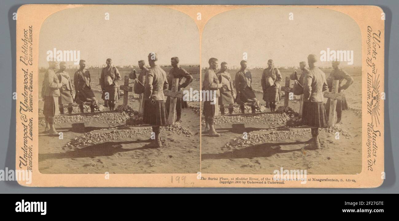 Men in a cemetery for British soldiers who have fallen away during the Battle of Magersfontein; The Burial Place, at Mudder River, or the Highlanders Who Fell at Stomer's fountain, S. Africa .. Stock Photo