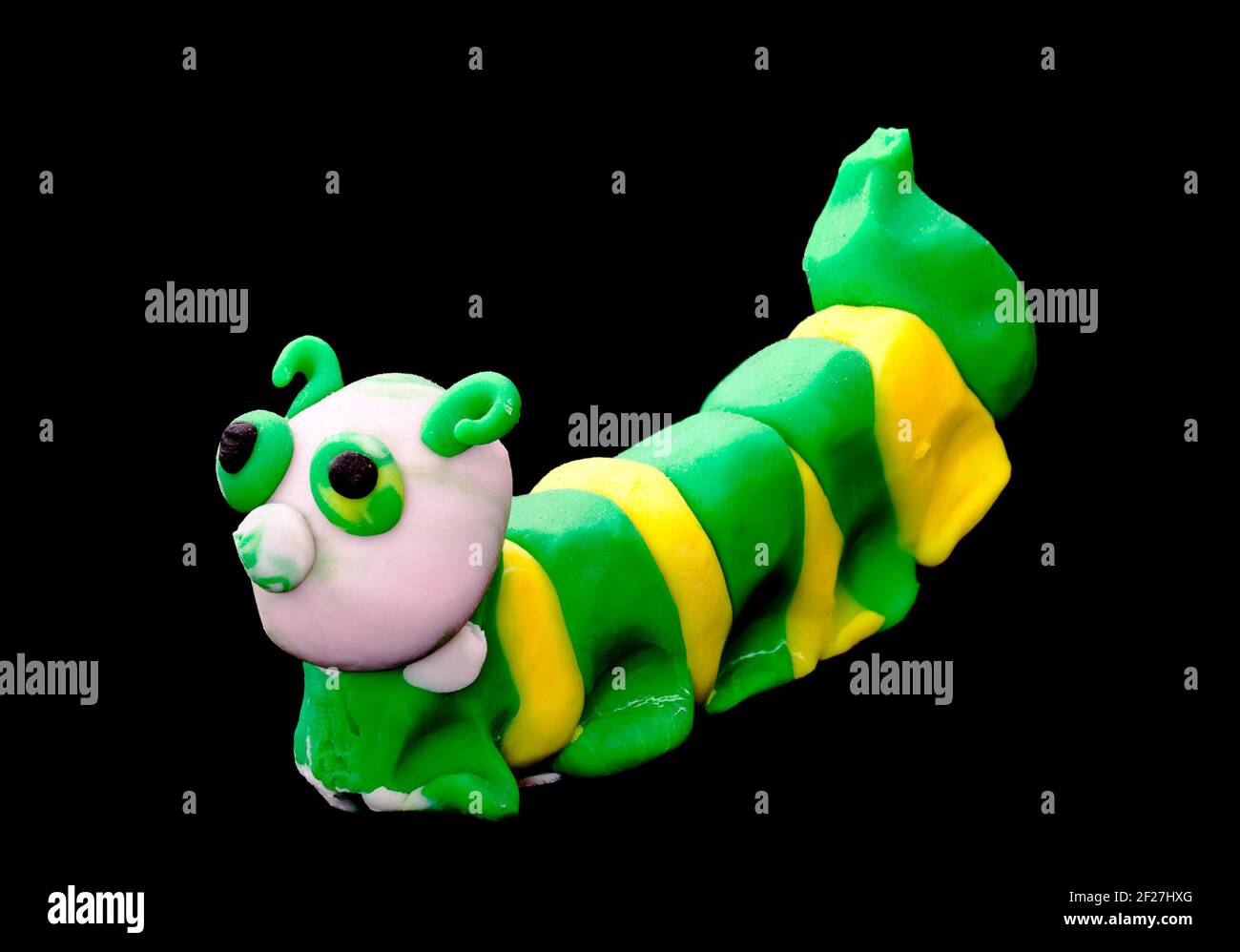 Plasticine caterpillar. Creativity of children from preschool age Stock Photo