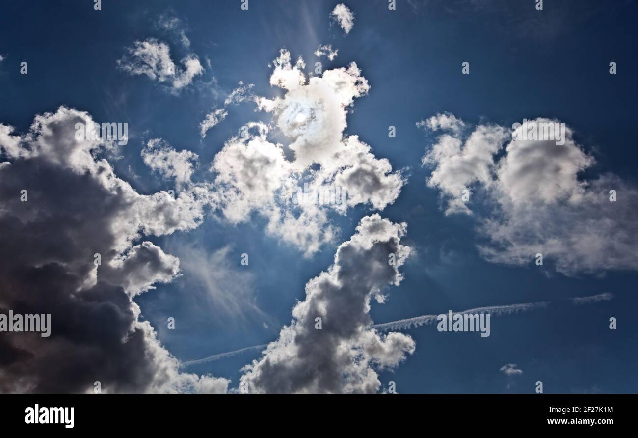 The dark blue sky with cumulus clouds Stock Photo - Alamy