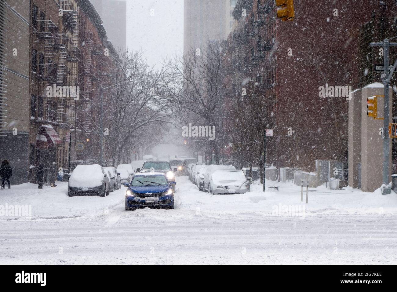 Christmas White winter snowfall day in the big apple new york city manhattan buildings streets and walkways Intersection Stock Photo