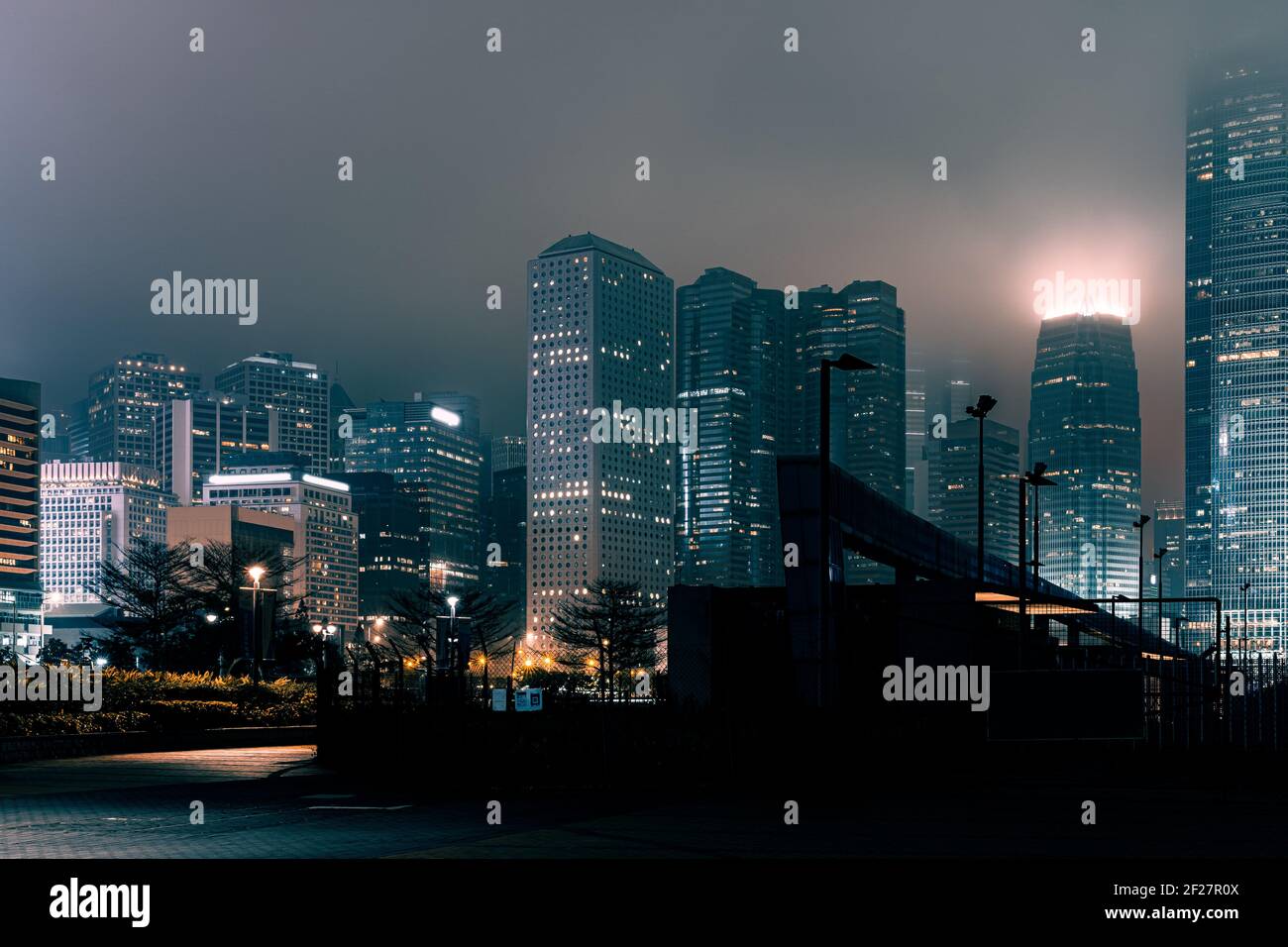 Modern office buildings in Hong Kong at foggy night Stock Photo - Alamy