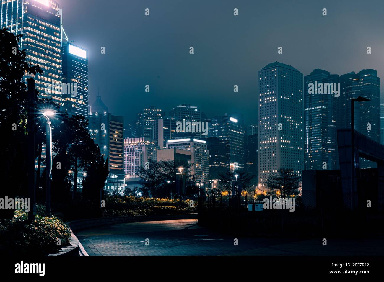 Modern office buildings in Hong Kong at foggy night Stock Photo - Alamy