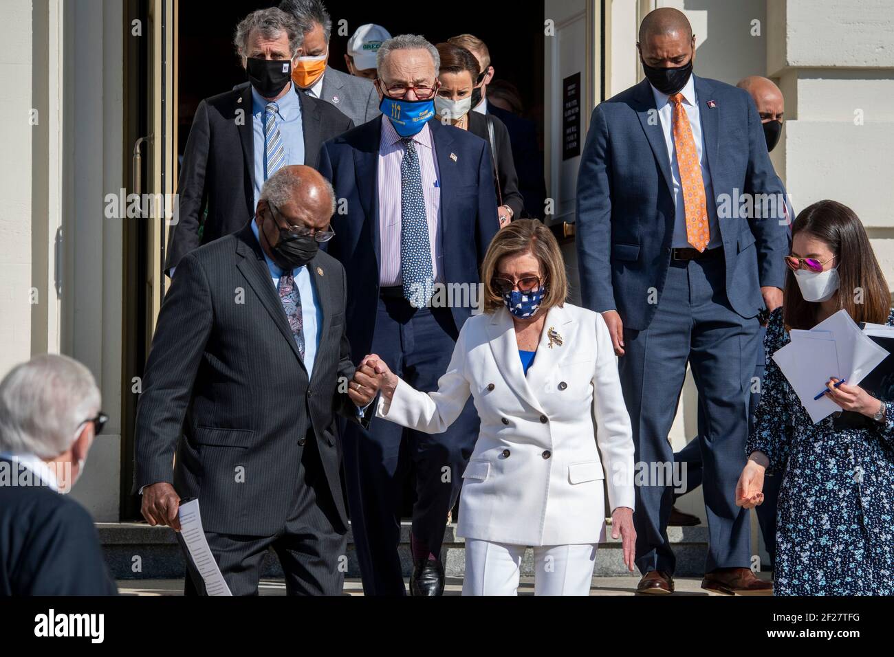 Washington, United States Of America. 10th Mar, 2021. Speaker of the United States House of Representatives Nancy Pelosi (Democrat of California), right, walks with United States House Majority Whip James Clyburn (Democrat of South Carolina), left, down the steps prior to the signing of the American Rescue Plan Act of 2021 on the West Terrace of the U.S. Capitol in Washington, DC, Wednesday, March 10, 2021. Credit: Rod Lamkey/CNP | usage worldwide Credit: dpa/Alamy Live News Stock Photo