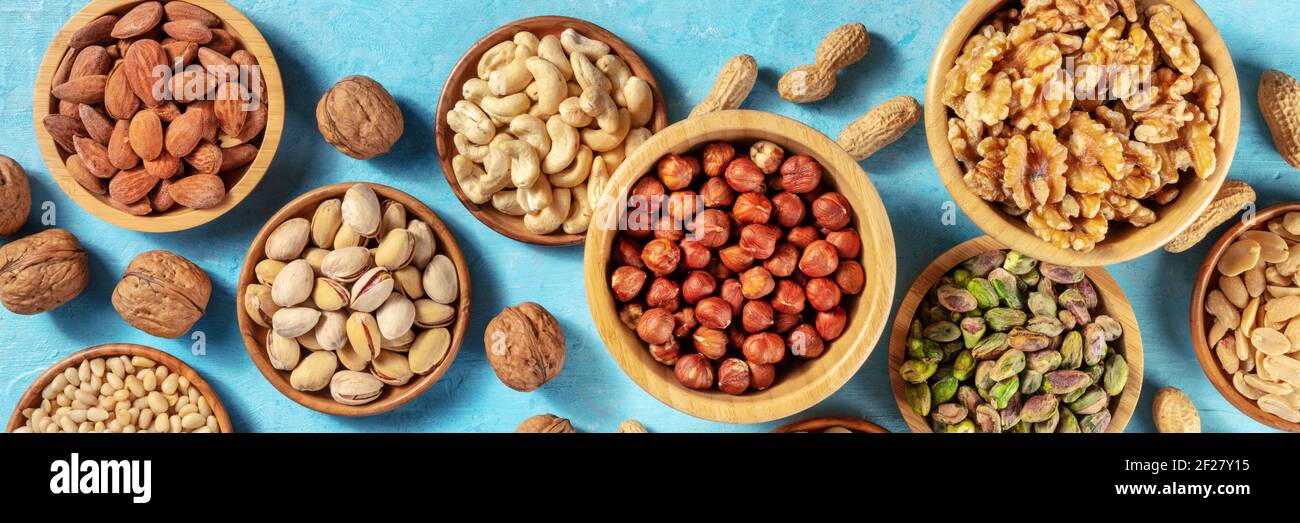 Nuts assortment panorama with many different nuts Stock Photo