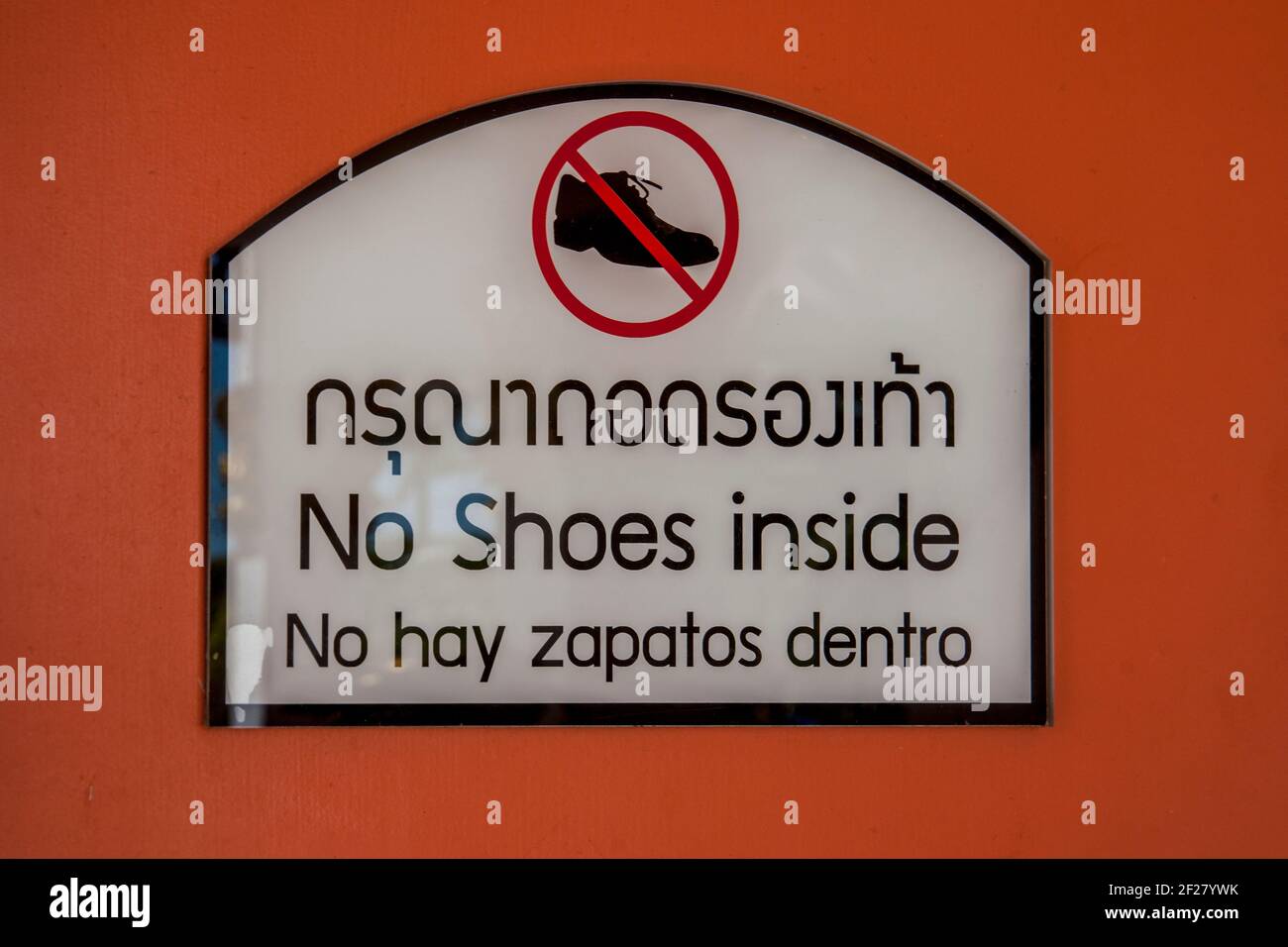 “No Shoes Inside” sign at the Thai Buddhist Temple, Wat Buddharangsi of Miami, located in the rural Redland area of Miami-Dade County, Florida. Stock Photo