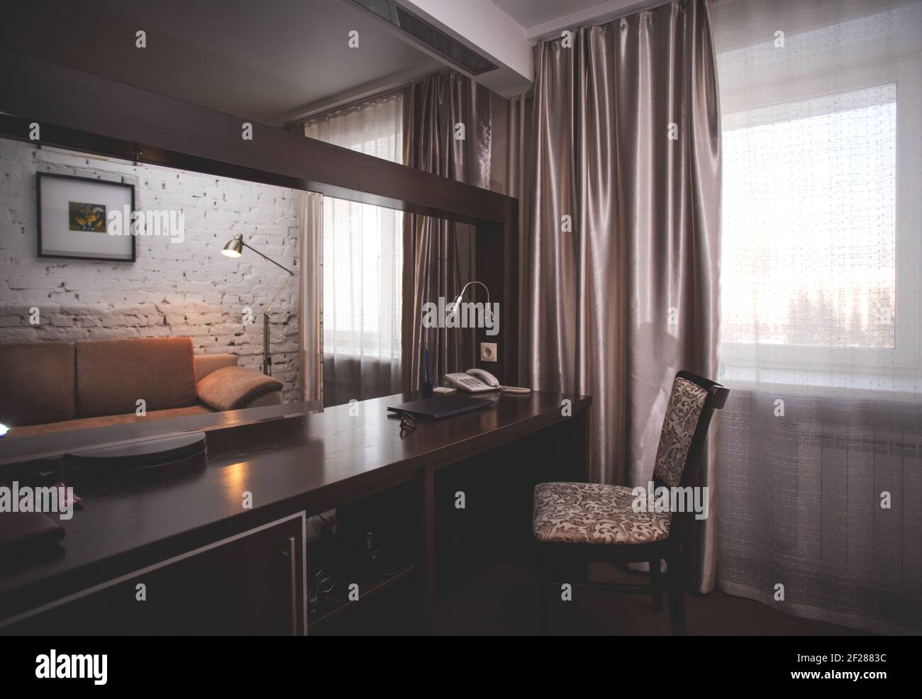 Interior of a comfortable hotel bedroom in the morning in luxury style ...