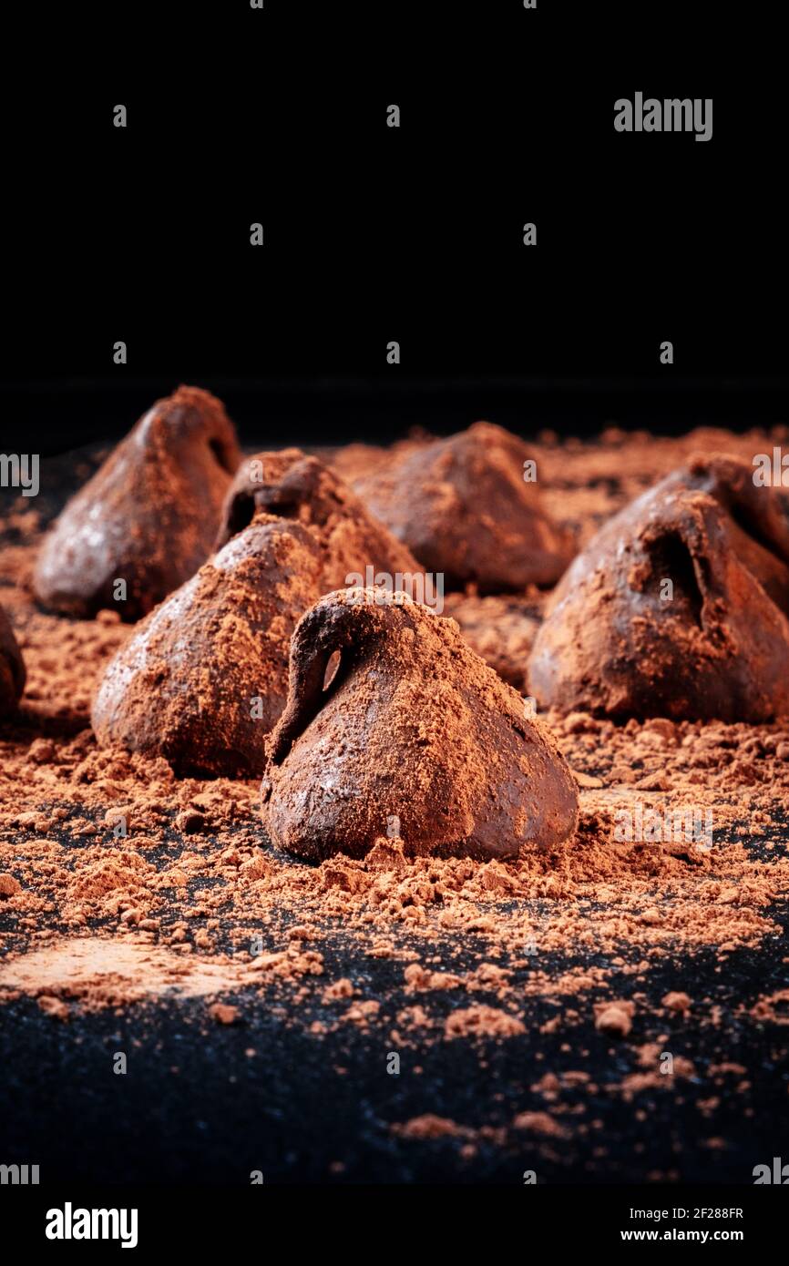 Many chocolate truffles on a black background Stock Photo