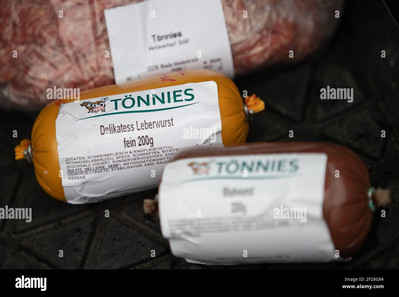 04 March 2021, North Rhine-Westphalia, Rheda-Wiedenbrück: Minced meat, a  liver sausage and a black pudding from Tönnies lie next to each other. The  family business Tönnies is Germany's largest slaughterhouse for pigs. (