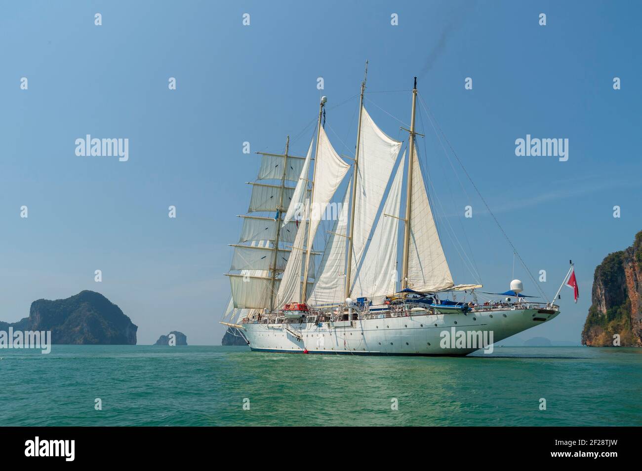 Star Clipper Cruise Ship Sailing In Phang Nga Bay Thailand Stock Photo star-clipper-cruise-ship-sailing-in-phang-nga-bay-thailand-stock-photo
