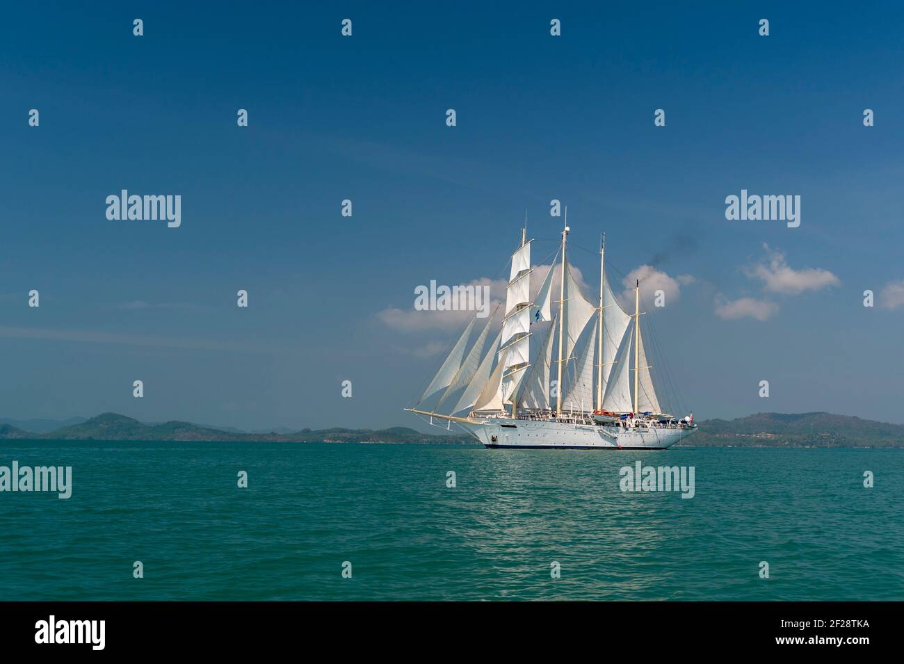 Star Clipper Cruise Ship Sailing In Phang Nga Bay Thailand Stock Photo star-clipper-cruise-ship-sailing-in-phang-nga-bay-thailand-stock-photo