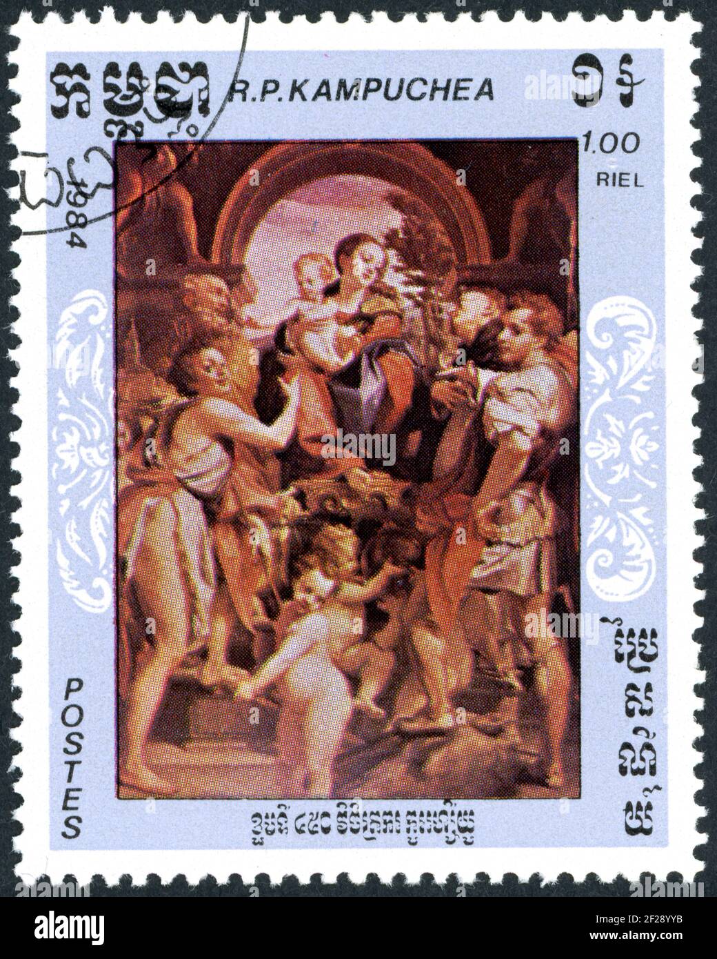 A stamp printed in Kampuchea, shown the painting: Madonna&Child with St. John the Baptist, Geminian - Peter Martyr and George, by Antonio da Correggio Stock Photo