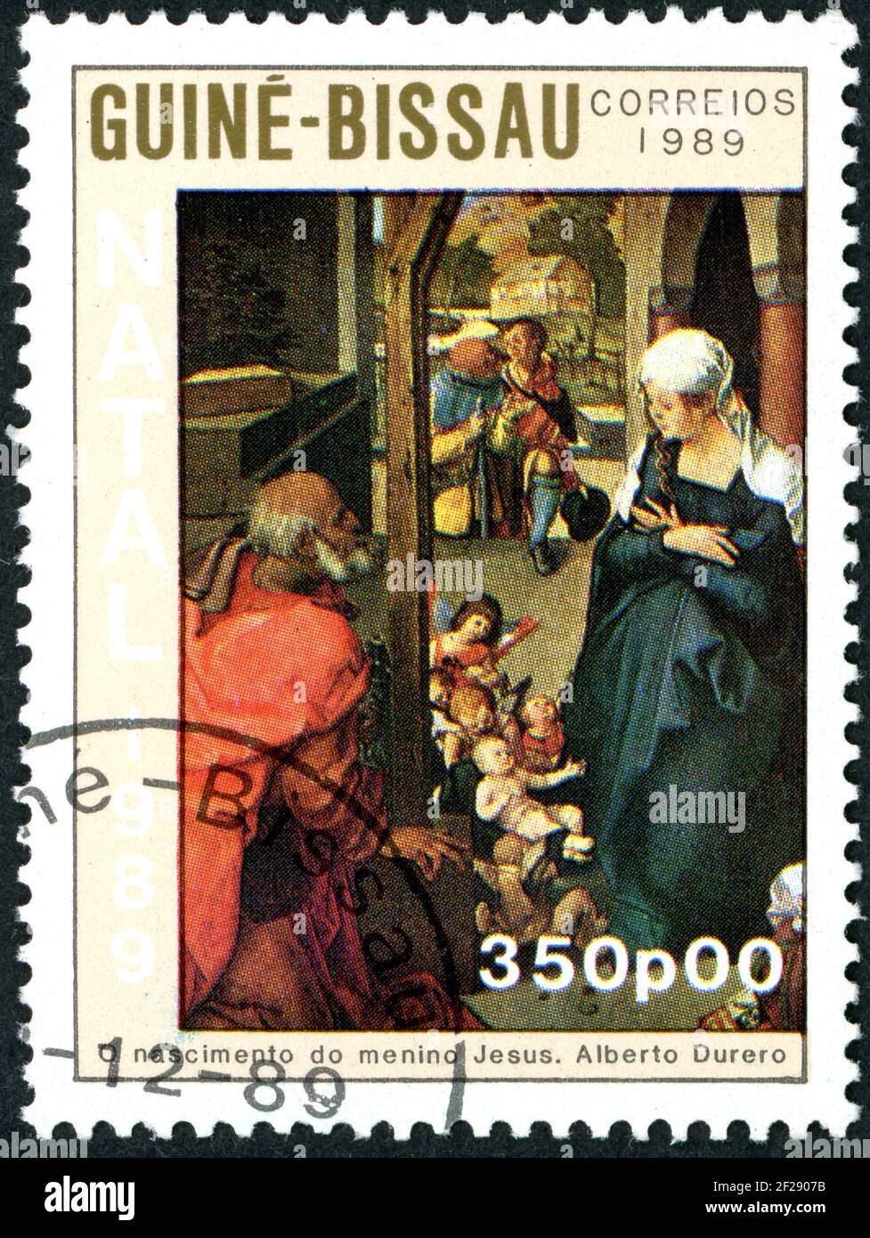 A stamp printed in Guinea-Bissau, shown the painting by Albrecht Duerer - Madonna and Child and the Adoration of the Magi, circa 1989 Stock Photo