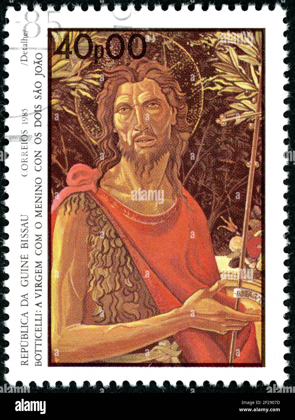 GUINEA-BISSAU - CIRCA 1985: A stamp printed in Guinea-Bissau, shown the painting by Botticelli (detail) - Virgin with Child and St. John, circa 1985 Stock Photo