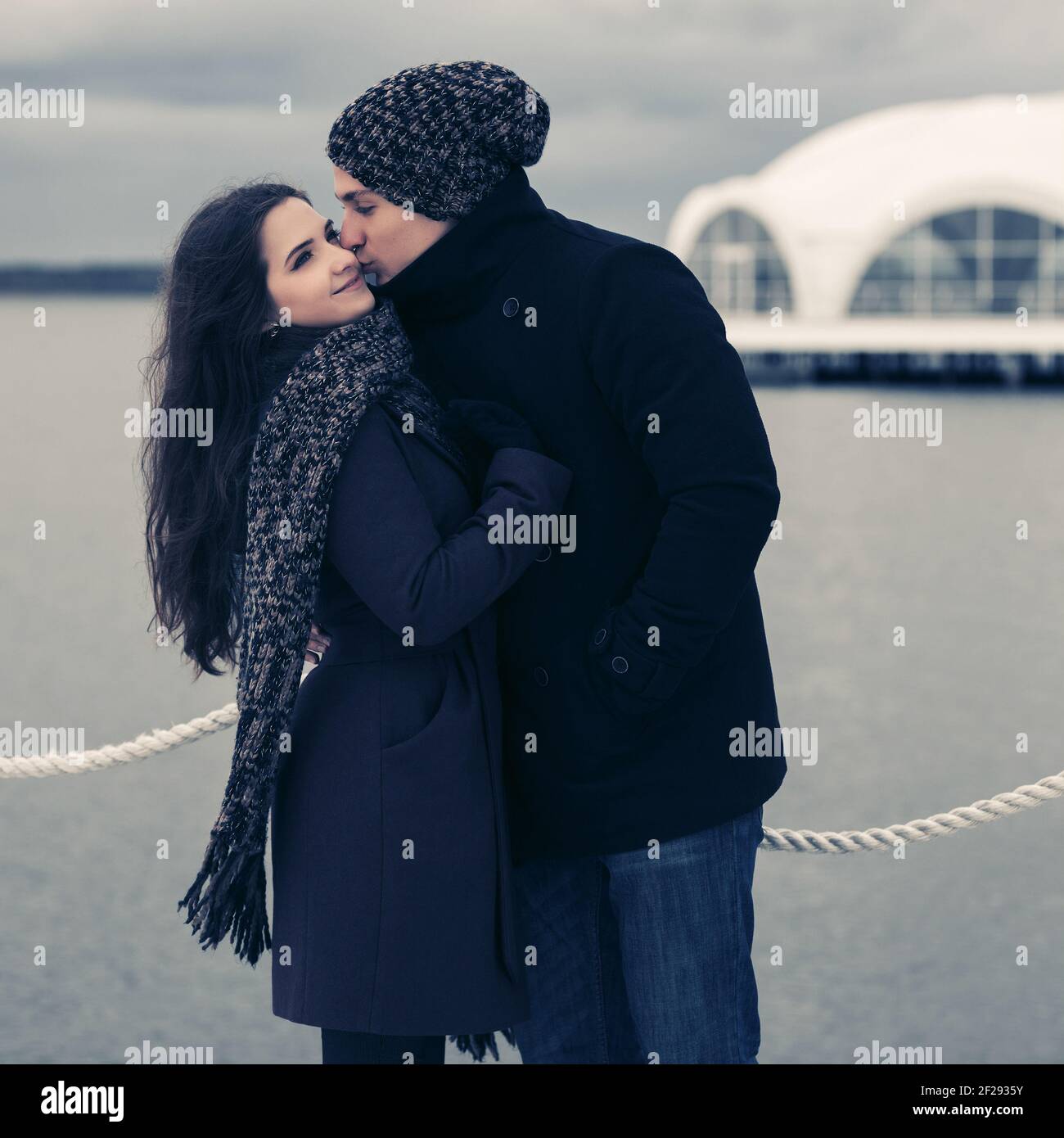 Couple kissing wearing winter coats hi-res stock photography and images -  Alamy