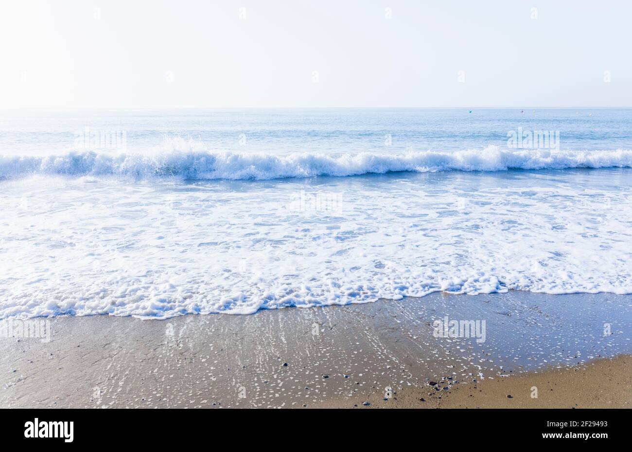 Waves breaking on shore. Stock Photo