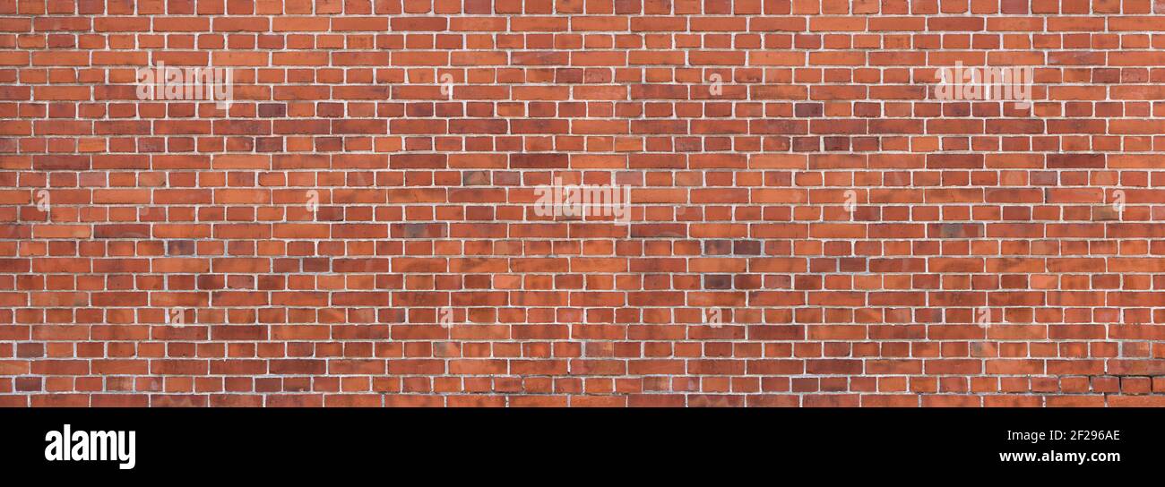 Old, dirty, red brick wall - panoramic detail Stock Photo
