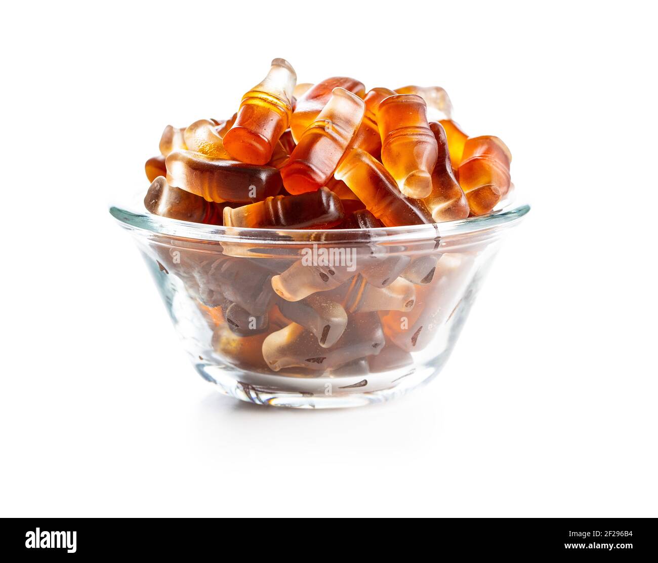 Jelly candies with cola flavor in bowl isolated on white background. Stock Photo